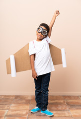 Wall Mural - African American boy  with aviator hat and with wings