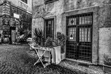 Wall Mural - Laundry rack in a rustic corner in Rome in black and white