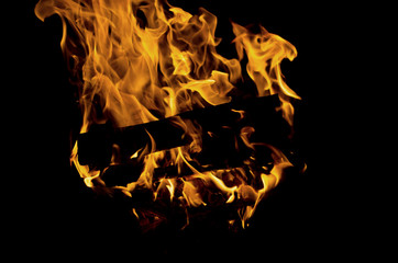 Closeup image of bonfire on black background