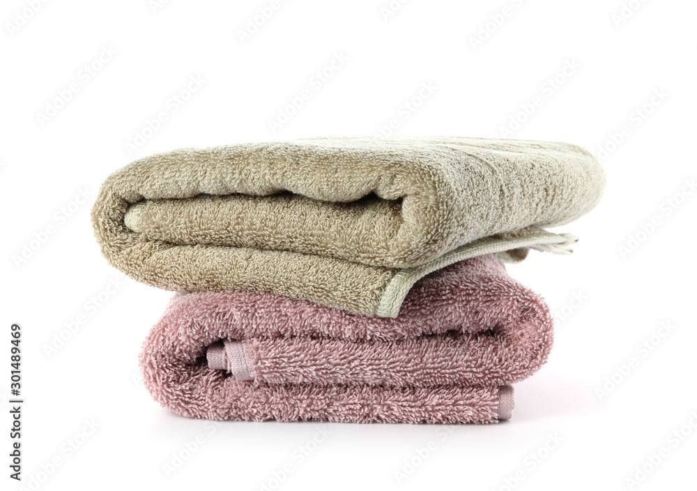 Stack of clean towels on white background