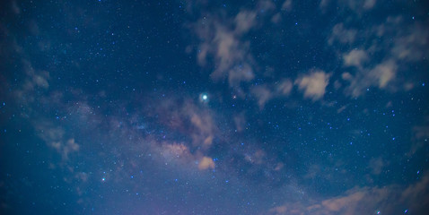Panorama blue night sky milky way and star on dark background.Universe filled, nebula and galaxy with noise and grain.Photo by long exposure and select white balance.Dark night sky.