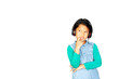 © arhendrix - Asian pretty little girl in green shirt listening music in headphones and singing on white background. Charming girl in shorts and earphones inner thinking with lyric and copy space for wording.