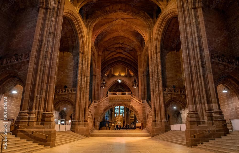 LIVERPOOL, ENGLAND, DECEMBER 27, 2018: Panoramic view of the magnificent huge entrance hall of the Church of England Anglican Cathedral of the Diocese of Liverpool. - obrazy, fototapety, plakaty 