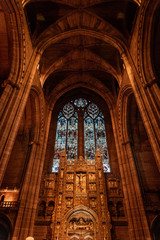 Wall Mural - LIVERPOOL, ENGLAND, DECEMBER 27, 2018: Magnificent stained glass from interior of the Church of England Anglican Cathedral of the Diocese of Liverpool with biblical sculptures of jesus christ.