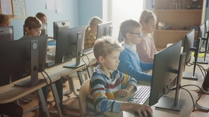 Elementary School Computer Science Classroom: Diverse Group of Little Smart Schoolchildren using Personal Computers, Learn Informatics, Internet Safety, Programming Language for Software Coding