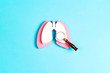 Prevention of pulmonary disease. Lung symbol with magnifier on a blue background.