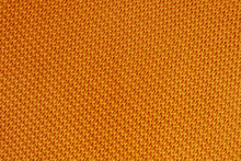 Orange Knitted Background. Detailed Diagonal Knitting Texture. Garter Stitch Pattern. Closeup