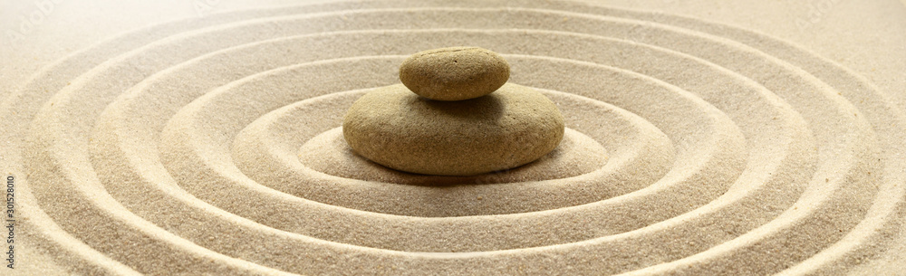zen garden meditation stone background with stones and lines in sand for relaxation balance and harmony spirituality or spa wellness - obrazy, fototapety, plakaty 