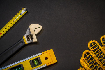 Tools for master builder prepared before work on a black background