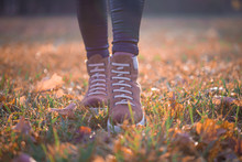 Woman Legs Boots In Autumn Nature