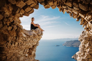 view from monolithos, landscape at the island rhodes, greece. girl admires the beauty of the landsca