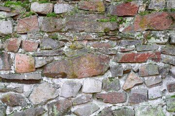 Old stone wall, stone wall texture with moss