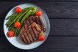 Grilled beef steak ribeye with cherry tomatoes and asparagus
