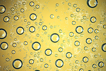 green wet background / raindrops for overlaying on a window, weather, background drops of rain water on a glass transparent