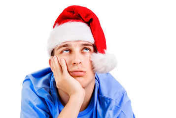 Canvas Print - Unhappy Young Man in Santa Hat