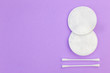 © Garmon - Flat lay composition with cotton hygienic products on pastel violet background with copy space.