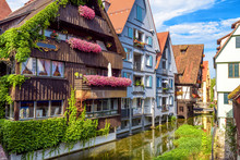Vintage Street With Houses Decorated By Flowers In Old Town Of Ulm, Germany. Nice View Of Historical Fisherman`s Quarter In Summer. It Is A Landmark Of Ulm. Ancient District Of Ulm City With Canals.