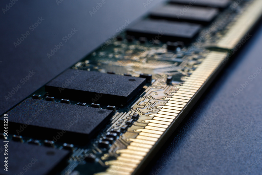 Random access memory module on a dark background. The concept of lack of memory, poor mental process of a person, the need for self-development. Selective focus. - obrazy, fototapety, plakaty 