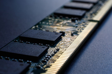 Random access memory module on a dark background. The concept of lack of memory, poor mental process of a person, the need for self-development. Selective focus.