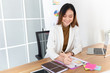 © jokekung - smart asian officer write report on paper, she sitting and feeling happy in work time, strategy analyze and information data research, management organization
