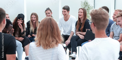 Fotomural close up. group of young people sitting in a circle.