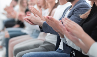 Wall Mural - group of young people applauding sitting in the conference room.