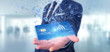 © Production Perig - Man holding a contactless credit card payment concept 3d rendering