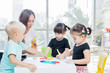 © Creativa Images - Preschool kids learns to draw with their teacher