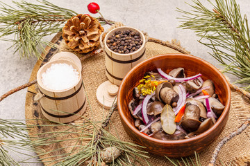 Wall Mural - Pickled (fermented) mushrooms. Traditional New Year (Christmas) snack. Festive table cutlery setting