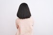 © Krakenimages.com - Young chinese woman wearing turtleneck sweater standing over isolated white background standing backwards looking away with crossed arms