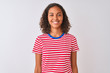 © Krakenimages.com - Young brazilian woman wearing red striped t-shirt standing over isolated white background with a happy and cool smile on face. Lucky person.