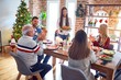 © Krakenimages.com - Beautiful family meeting smiling happy and confident. Person standing holding roasted turkey celebrating Christmas at home