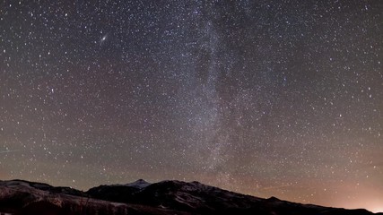 Wall Mural - Amazing time-lapse of the stars moving across the night sky.