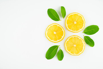 Fresh slice lemon with leaves, vitamin c supplement from natural  isolated on white background with copy space