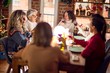 © Krakenimages.com - Beautiful group of women smiling happy and confident. Eating roasted turkey celebrating christmas at home