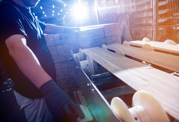 Wall Mural - Carpenter with fibreboards at furniture factory workshop. Woodworking industry