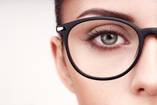 Female Eye With Long Eyelashes In Eyeglasses. Model In Glasses. Vision Correction. Poor Eyesight. Spectacle Frame. Makeup, Cosmetics, Beauty. Close Up, Macro