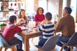 © Krakenimages.com - Beautiful family smiling happy and confident. Eating roasted turkey celebrating christmas at home