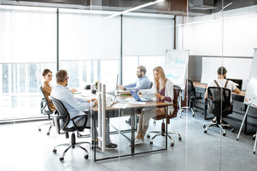Wall Mural - group of diverse colleagues working on the computers in the modern office or coworking space, wide i