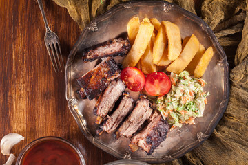 Wall Mural - Spicy barbecued pork ribs with french fries