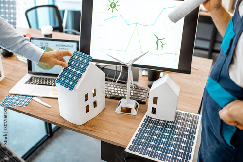 Cuadros en Lienzo People working on a project of alternative energy, working with house model and