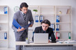 © Elnur - Two young employees working in the office