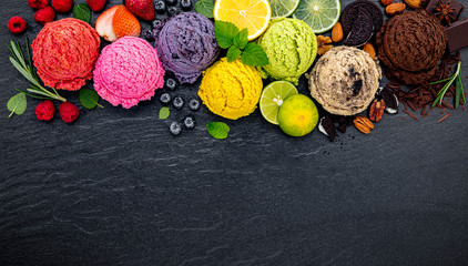 Fototapete - Various of ice cream flavor ball blueberry ,lime ,pistachio ,almond ,orange ,chocolate and vanilla set up on dark stone background . Summer and Sweet menu concept.