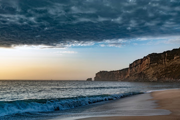 Wall Mural - Evening time by Atlantic ocean in Nazare, Portugal.