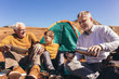 © Mediteraneo - Three generations of family camping together in the autumn.