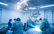 © Vadim - Medical team hospital performing operation. Group of surgeon at work in operating room. healthcare.