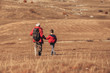 © Mediteraneo - Senior man with grandson on country walk in autumn.