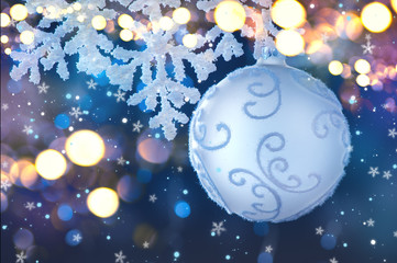 Wall Mural - silver color christmas and new year decoration on blurred grey background with lights. border art de