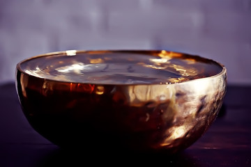 clear water in a golden bowl / clear water in a yellow iron bowl