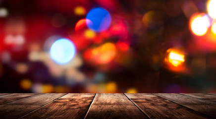 wooden table, blurred bokeh background background. neon light, night view, close-up. the general bac